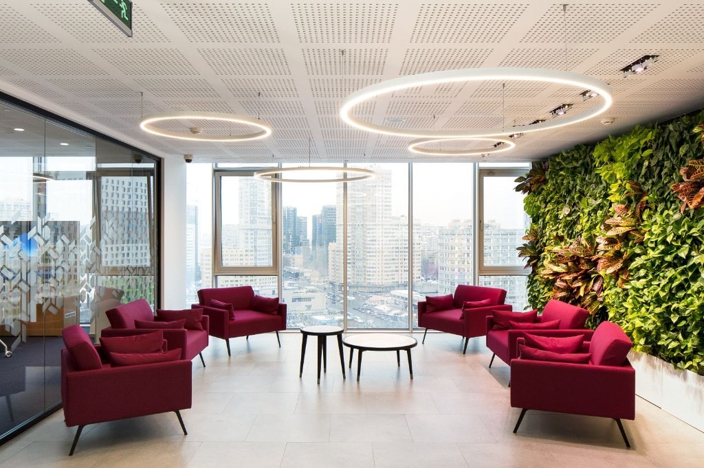 Lounge with magenta seating and city skyline views