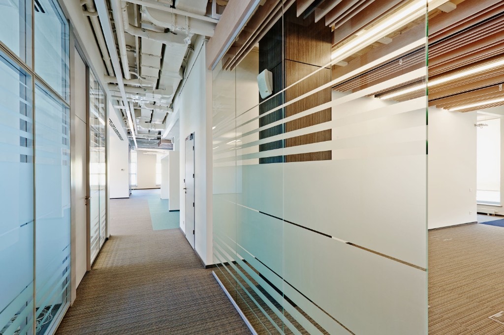 Glass corridor with frosted stripe partitions