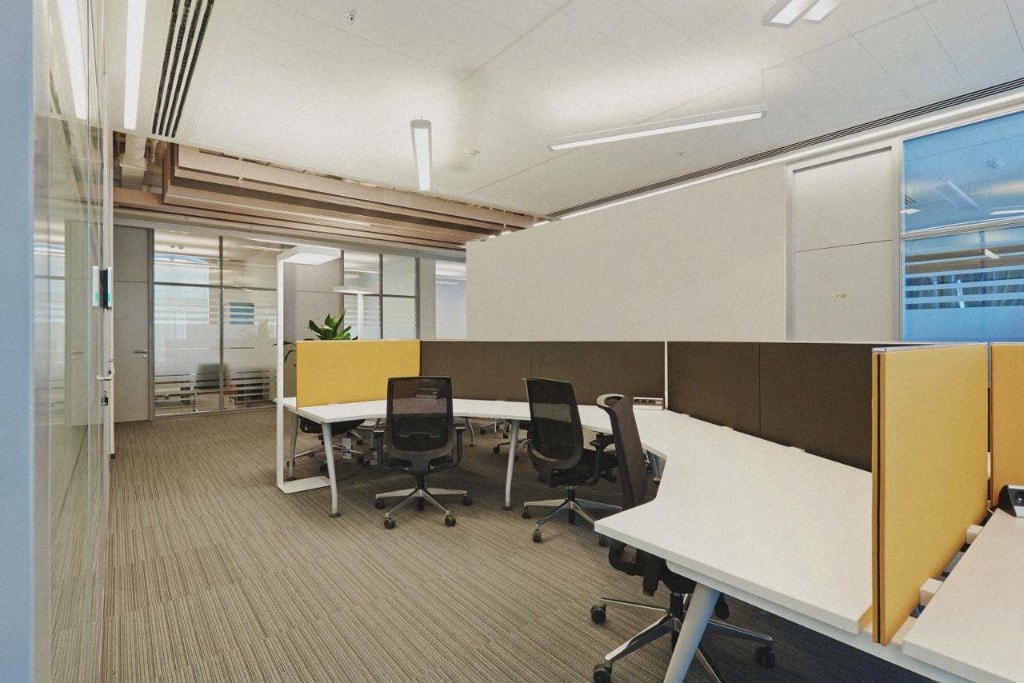 Open workspace with curved desks and yellow privacy screens
