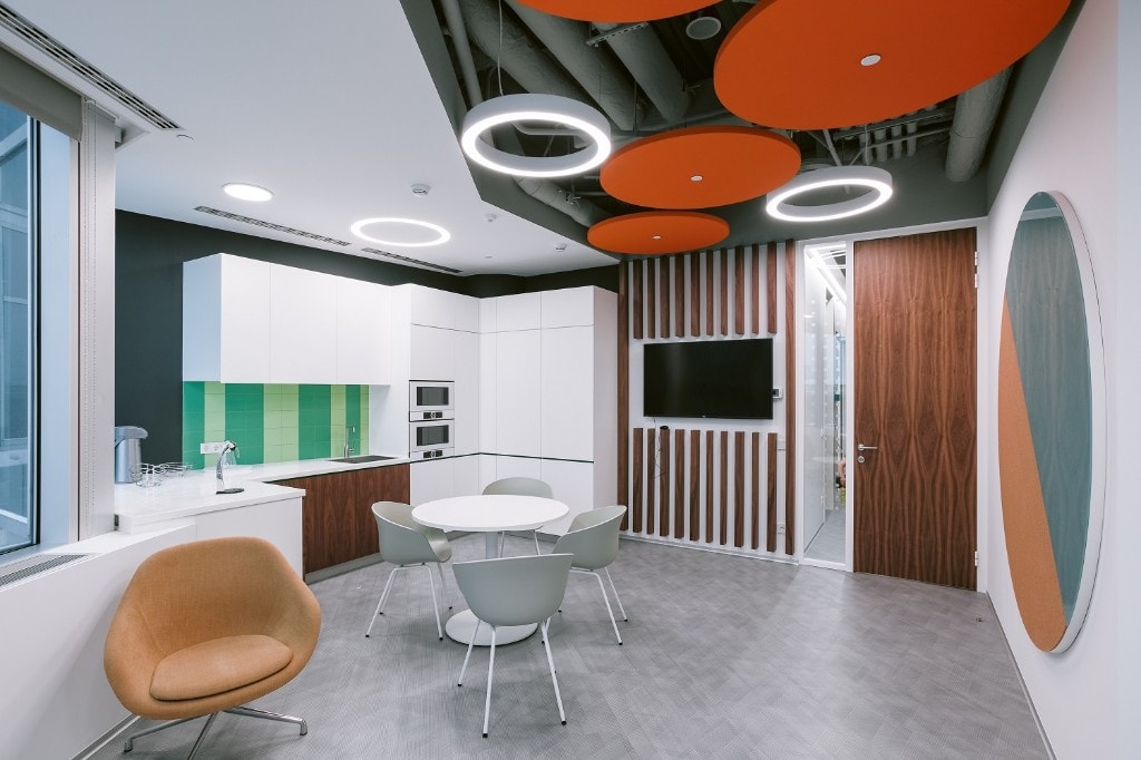 Pantry breakout with green tile backsplash and orange acoustic clouds