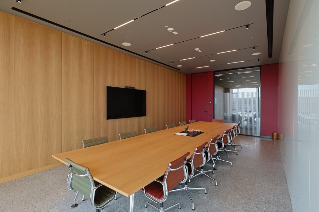 Executive boardroom with world map feature and balcony windows