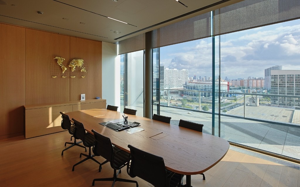 Conference room with blue seating and city views