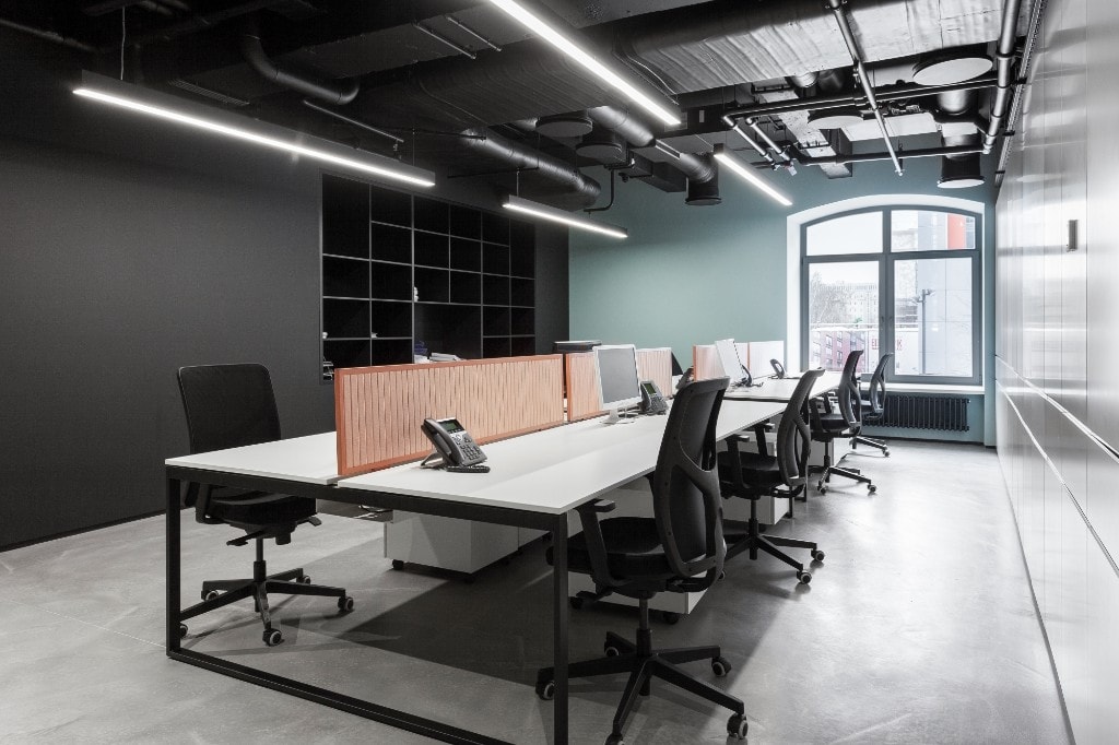 Workspace with arched window and linear lighting